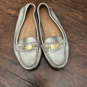 Gold Calvin Klein loafers